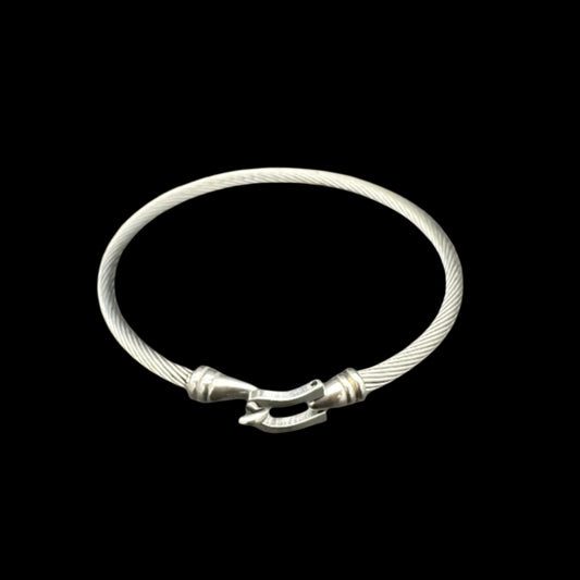 Silver bracelet on a dark gray background