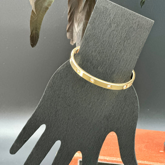 18K gold-plated crystal bangle bracelet with bezel-set stones, sleek polished design, tarnish-resistant and hypoallergenic.