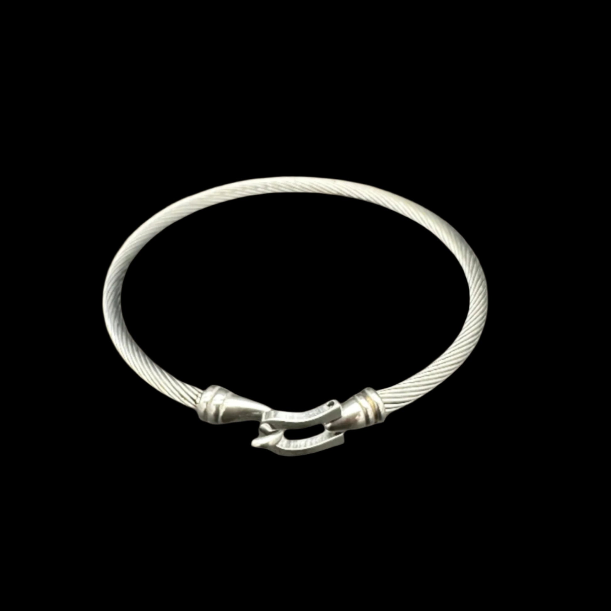 Silver bracelet on a dark gray background