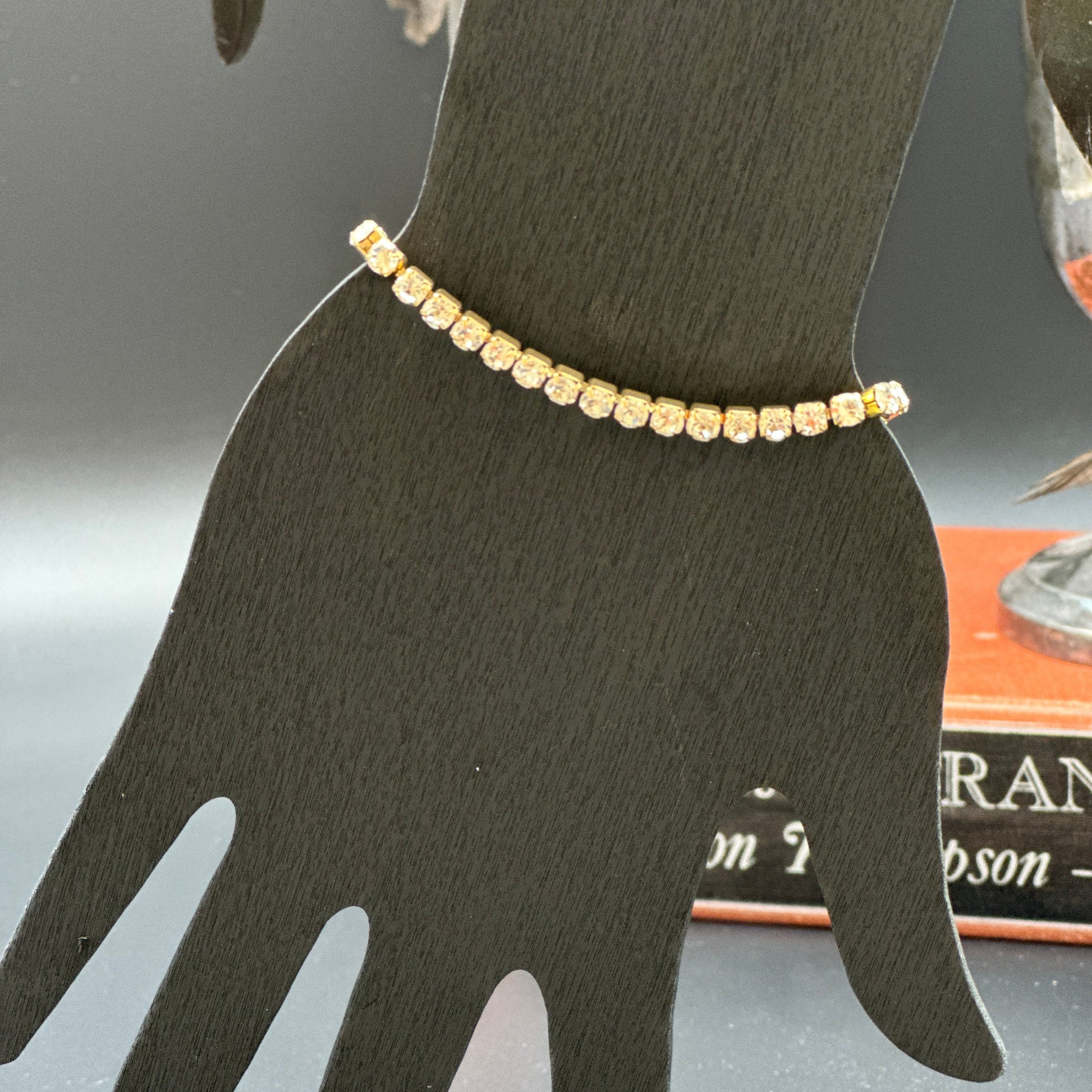 18K gold plated tennis bracelet with round cubic zirconia stones on wrist, elegant and tarnish-resistant